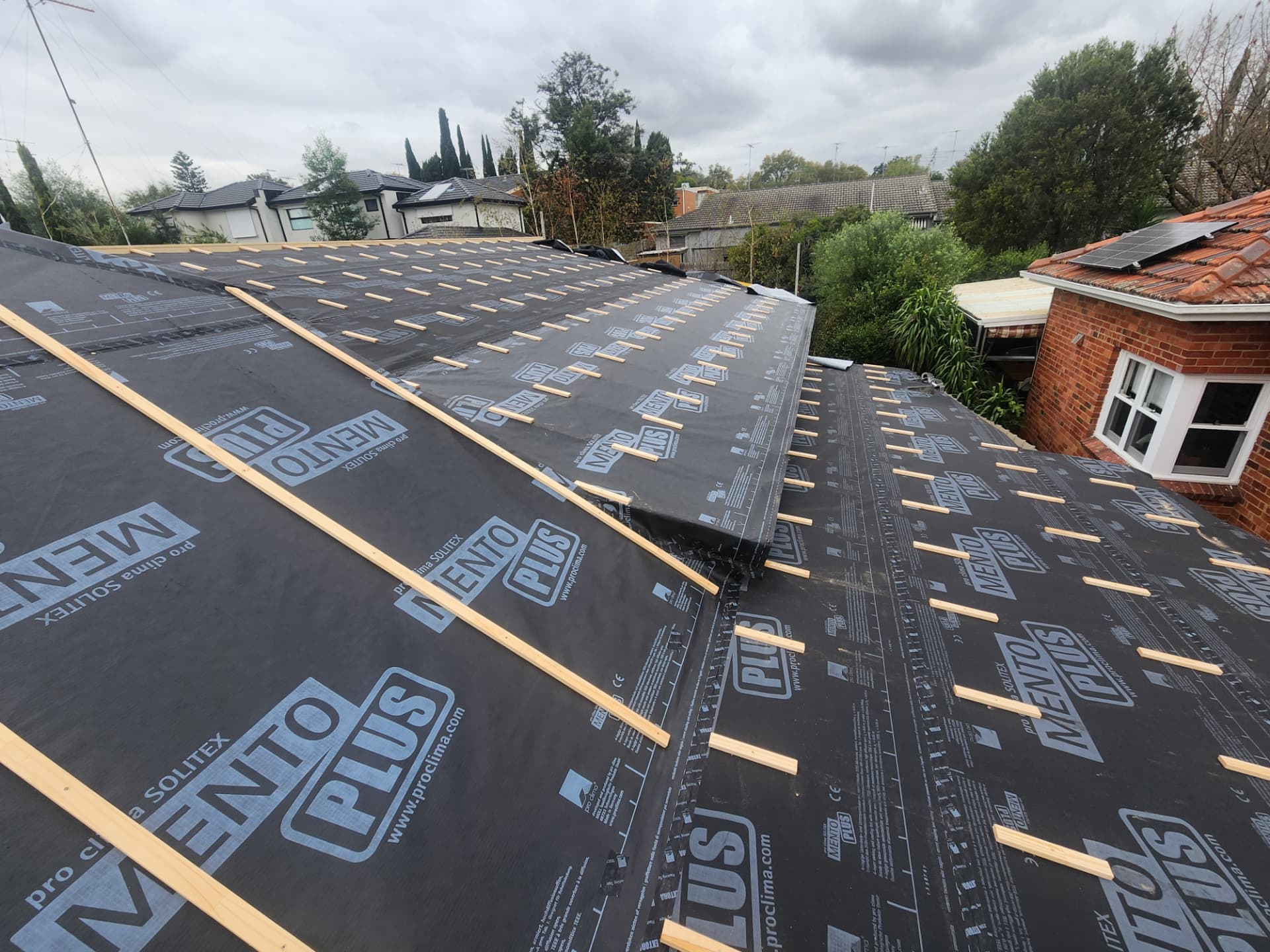Roof sarking and timber battens installed over a new extension roof