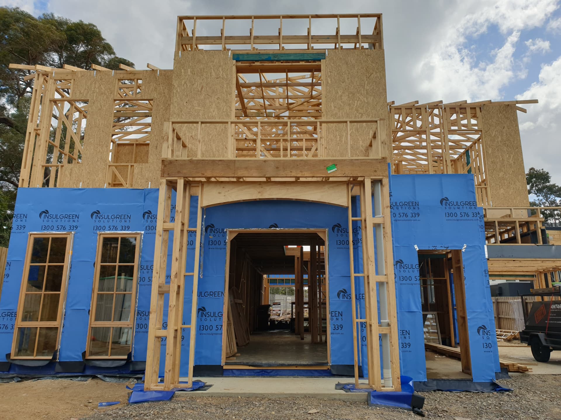 Two storey timber frame with wrap and window openings